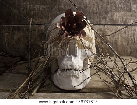 Skull and flower branches.