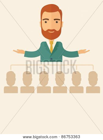 An executive good looking and happy  Caucasian with beard explaining and presenting a business marketing plans to his employees in front of him inside the training room. Planning a business concept. 