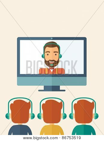 A happy Caucasian businessman in a monitor with beard giving a business presentation with three men in front of him wearing their headphones . Business presentation concept. A contemporary style 