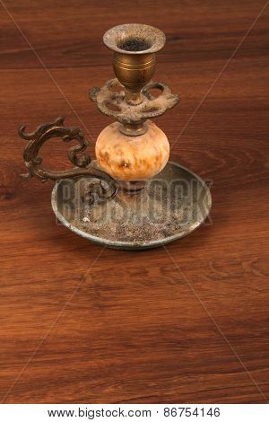 The Vintage Candlestick On The Wood