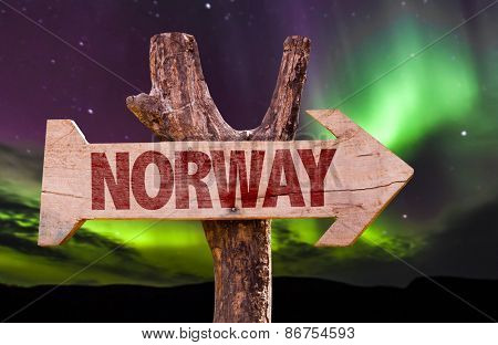 Norway wooden sign with northern lights background