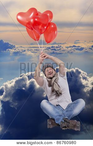 Young man flying on balloons with cloud sky in background