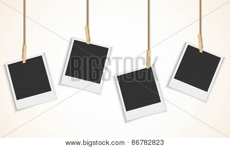 Blank photo frame hanging on a rope