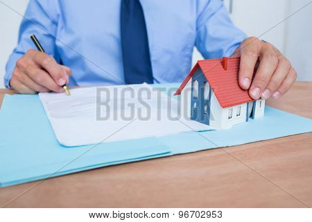 Businessman reading a contrat before signing it in the office