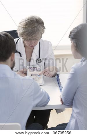Gynecologist Explaining In Vitro Process