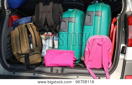 Trunk Of A Car Overloaded With Suitcases  For Family Travel