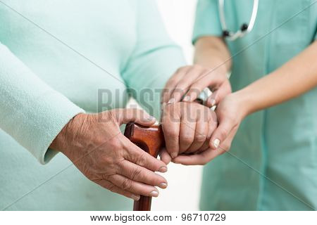 Carer Helping Disabled Female