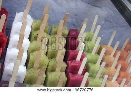 bunch of colourful ice creams on stick