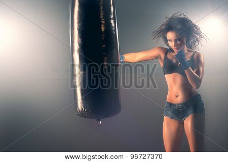 Boxing training woman sparring punching bag