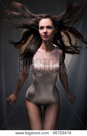 lady in combidress behind tulle