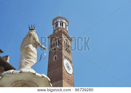 VERONA, ITALY - JULY 13: Detail of Madonna Verona fountain statue with Maffei Palace in the background. July 13, 2015 in Verona.