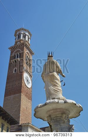 VERONA, ITALY - JULY 13: Detail of Madonna Verona fountain statue with Maffei Palace in the background. July 13, 2015 in Verona.
