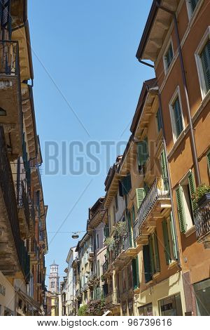 VERONA, ITALY - JULY 11: Via Mazzini with Lamberti Tower in the far background. July 11, 2015 in Verona. Via Mazzini is one of the main commercial streets in Verona.