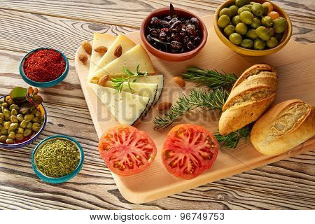 Mediterranean food bread oil olives cheese spices peppers garlic almods rosemary