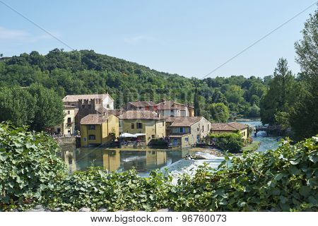 BORGHETTO, ITALY - JULY 11: Village of Borghetto surrounded by vegetation and coasted by river Mincio. July 11, 2015 in Borghetto.