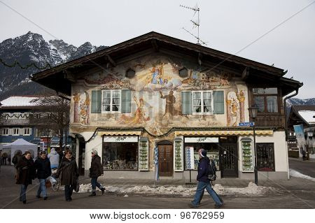 GARMISCH PARTENKIRCHEN, GERMANY. Feb 04 2011: Preview images for the 2011 Alpine skiing World Championships. Tourists walk past a shop in the town centre