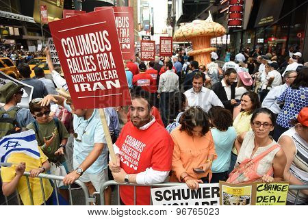 Rally attendees with signs in Times Square