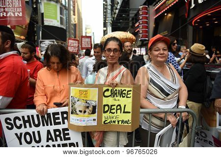 Activists in Times Square with signs