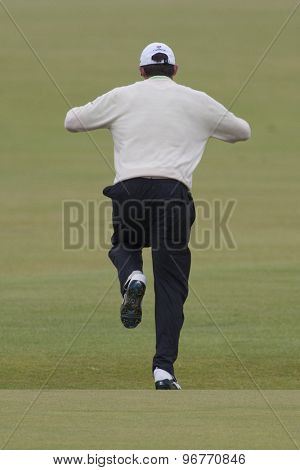 ST ANDREWS, SCOTLAND. July 15 2010: Padraig HARRINGTON from the Republic of Ireland jumps across the burn on the first hole during the first day of The Open Championship