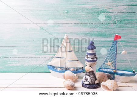 Decorative Lighthouse,  Sailing Boats And Marine Items On Wooden Background.