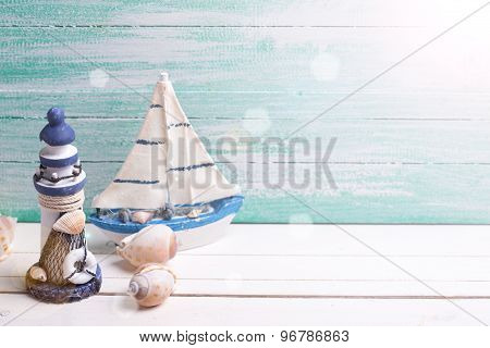 Decorative Lighthouse,  Sailing Boats And Marine Items On Wooden Background.