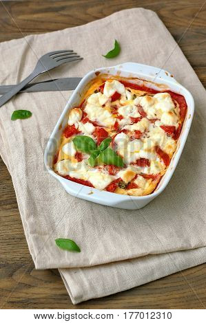 Gluten Free Meal From Roasted Corn Flour, Tomato, Goat Cheese And Basil In White Bowl On The Cloth O