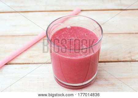 Healthy Fresh Smoothie Drink From Raspberries And Coconat In Glass With Straw