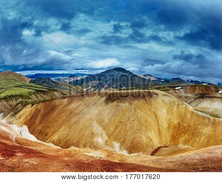 Valley National Park Landmannalaugar. On the gentle slopes of the mountains are snow fields and glaciers. Magnificent Iceland in the August