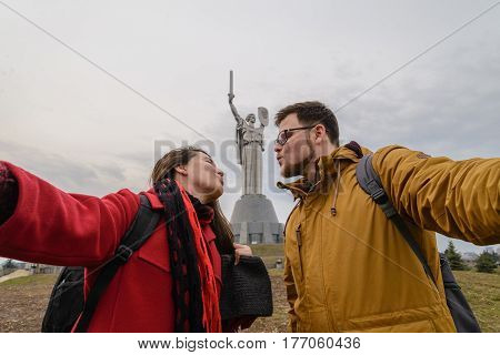 Mother Motherland monument - couple takes selfie in front of statue