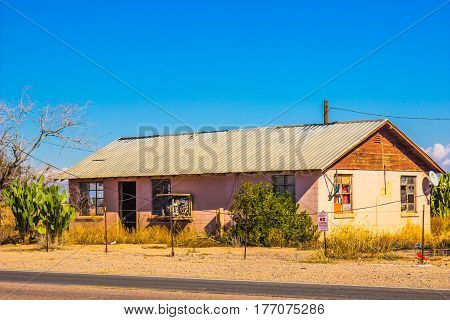 Old Home With Broken Windows Abandoned Because Of The Recession