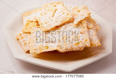 Typical Italian sweet fried carnival in the studio on a white background.