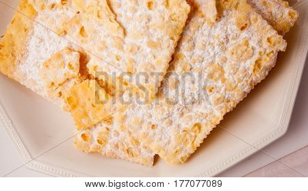 Typical Italian sweet fried carnival in the studio on a white background.