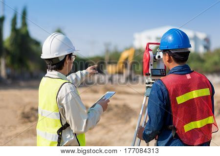 Construction engineer and foreman worker checking construction site for new Infrastructure construction project
