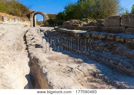 gate in Medieval cave city-fortress Chufut-Kale in the mountains, Bakhchisaray, Crimea.