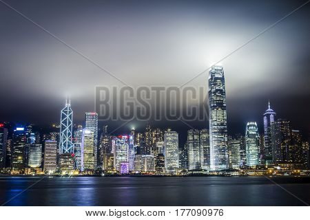 Hong Kong skyline at night with clouds