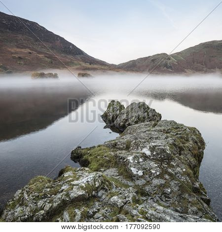 Stunning Winter Foggy Sunrise On Crummock Water In Lake District England