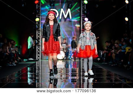 MOSCOW RUSSIA - MARCH 12 2017: Model walk runway for DETSKY MIR catwalk at Fall-Winter 2017-2018 at Mercedes-Benz Fashion Week Russia. Kid's fashion.