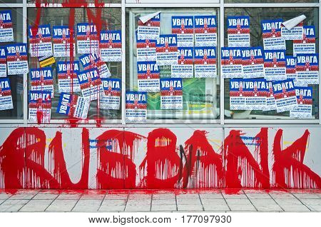 Dnipro Ukraine - March 17 2017 Protest against bank of country aggressor of Russia. Inscription on poster Attention this is bank of aggressor country it will be closed. Take away their money urgently