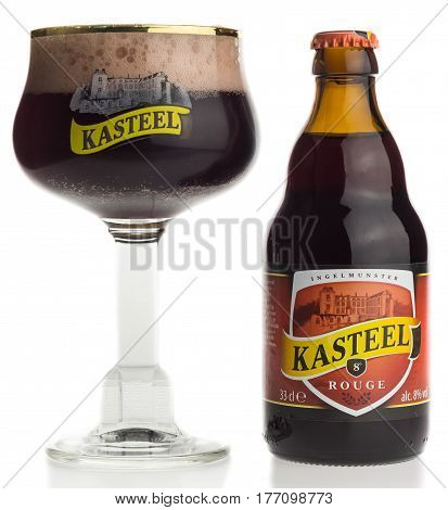 GRONINGEN, NETHERLANDS - MARCH 14, 2017: Bottle and glass of Kasteel Rouge fruit beer isolated on a white background