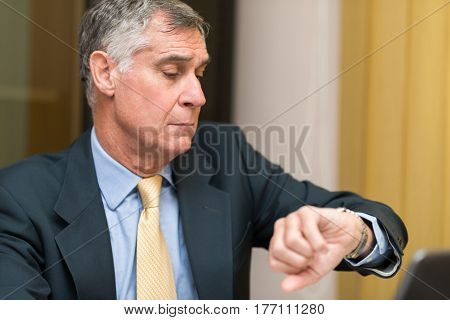 Businessman taking a look at his watch