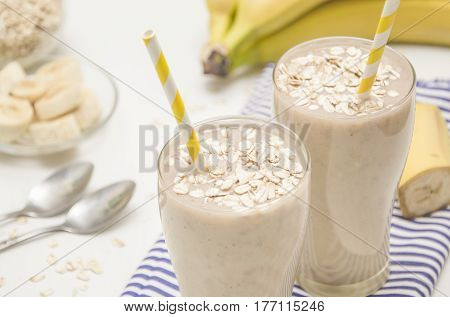 Milk shake with banana and oatmeal, healthy breakfast