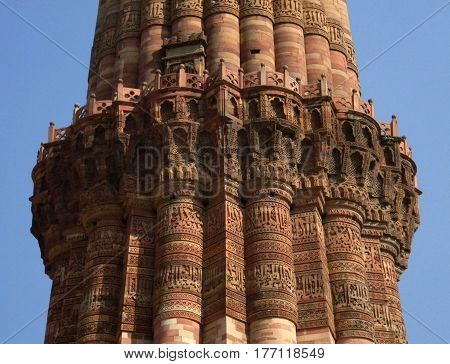 The Qutub Minar monument site details of architecture with masonry carvings in brick and sandstone.