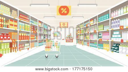 Supermarket aisle with shelves grocery items and full shopping cart retail and consumerism concept