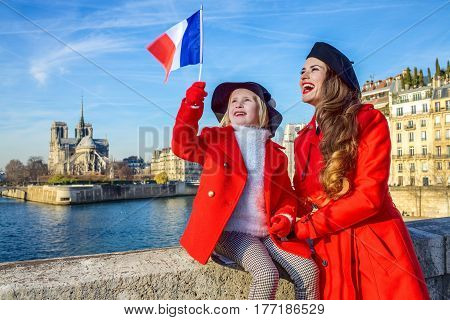 Stylish Mother And Child Travellers In Paris, France Rising Flag
