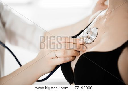 Female Medicine Doctor Holding Stethoscope To Pregnant Woman Standing For Encouragement, Empathy, Ch