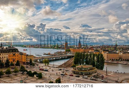 Scenic aerial view of Gamla Stan - Old Town - and Slussen in Stockholm Sweden with picturesque sunset sky