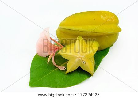 Starfruit isolated on white decorated with flowers and leafs