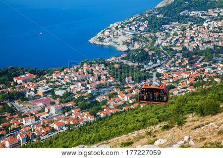 view from the top of mount Srdj to the city of Dubrovnik with a cable car moving down, Croatia