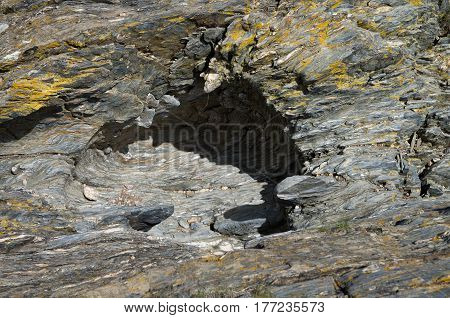Giant's kettle formed by eddying strong currents of water bearing stones. At Pulo do Lobo Guadiana river natural park the giant's kettles are formed on schist. Alentejo Portugal.