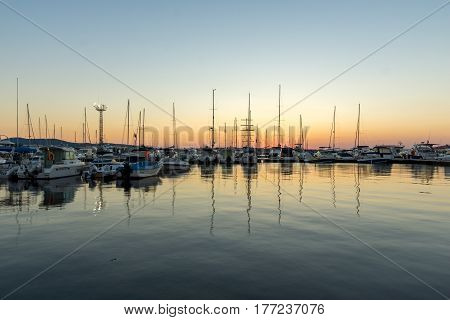 SOZOPOL, BULGARIA - JULY 11, 2016: Amazing Sunset at the port of Sozopol, Burgas Region, Bulgaria
